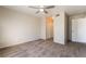 A bedroom with neutral walls, carpet, a ceiling fan, closet and bright natural light at 8070 W Russell Rd # 2015, Las Vegas, NV 89113