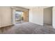 Bright bedroom with plush carpet and a sliding glass door to a private balcony at 8070 W Russell Rd # 2015, Las Vegas, NV 89113