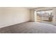 Open floor plan bedroom featuring plush carpeting and a sliding door to a private patio at 8070 W Russell Rd # 2015, Las Vegas, NV 89113