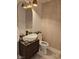Stylish bathroom features a vessel sink, marble countertop, and decorative light fixtures at 8170 Round Hills Cir, Las Vegas, NV 89113