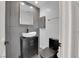 Contemporary bathroom with a sleek vessel sink, modern fixtures, and stylish gray tile at 8170 Round Hills Cir, Las Vegas, NV 89113