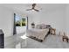 Bright bedroom with a comfortable bed, ceiling fan, and ample natural light at 8170 Round Hills Cir, Las Vegas, NV 89113