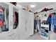 Organized closet with custom shelving, cabinets, and rods for ample storage at 8170 Round Hills Cir, Las Vegas, NV 89113