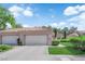 Charming home featuring a two-car garage, tiled roof, and well-maintained landscaping at 8170 Round Hills Cir, Las Vegas, NV 89113