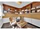 Cozy home office with built-in shelves, comfortable seating, and natural light at 8170 Round Hills Cir, Las Vegas, NV 89113