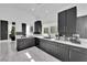 Well-appointed kitchen featuring sleek dark cabinetry, modern appliances, and ample counter space at 8170 Round Hills Cir, Las Vegas, NV 89113