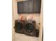 Laundry room features full-sized washer and dryer with overhead storage at 8170 Round Hills Cir, Las Vegas, NV 89113