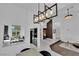 Open concept home with modern chandelier, and seamless views to the kitchen at 8170 Round Hills Cir, Las Vegas, NV 89113
