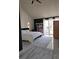 Bright main bedroom featuring a modern aesthetic and sliding glass doors at 8170 Round Hills Cir, Las Vegas, NV 89113