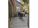 Patio with outdoor seating has neutral tones and a glimpse of landscaping at 8170 Round Hills Cir, Las Vegas, NV 89113