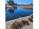 Picturesque pond with mature landscaping and mountain views at 8170 Round Hills Cir, Las Vegas, NV 89113