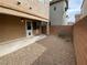 Small backyard with tan stucco exterior and landscaping at 8187 Deadwood Bend Ct, Las Vegas, NV 89178