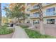 Exterior of building featuring path, palm tree, and lush green landscaping at 8255 Las Vegas Blvd # 1504, Las Vegas, NV 89123