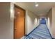 Hallway entrance with contemporary door and blue striped carpet at 8255 Las Vegas Blvd # 1504, Las Vegas, NV 89123