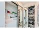 Functional laundry room with mirrored doors and storage shelves at 8255 Las Vegas Blvd # 1504, Las Vegas, NV 89123
