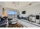 Sunlit living room with a leather sofa, decorative rug, and floor-to-ceiling windows showcasing scenic mountain views at 8255 Las Vegas Blvd # 1504, Las Vegas, NV 89123