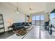 Bright living room featuring a leather sofa, area rug, and floor-to-ceiling windows with mountain views at 8255 Las Vegas Blvd # 1504, Las Vegas, NV 89123