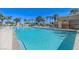 Large community pool with lounge chairs and a surrounding garden at 8255 Las Vegas Blvd # 1504, Las Vegas, NV 89123