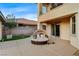 Serene backyard with an outdoor daybed on a paved patio, offering a perfect spot for relaxation at 9475 Windham Heights Ct, Las Vegas, NV 89139