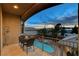 Balcony view with pool and palm trees, with room for relaxing at 9475 Windham Heights Ct, Las Vegas, NV 89139