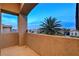 Cozy balcony offers an open view of a nearby palm tree and the community at 9475 Windham Heights Ct, Las Vegas, NV 89139