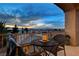 Relaxing balcony featuring a table, chairs, and expansive views of the surrounding landscape at 9475 Windham Heights Ct, Las Vegas, NV 89139