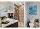 Bathroom featuring granite counters, tiled shower, toilet, and earth tone color palette at 9475 Windham Heights Ct, Las Vegas, NV 89139
