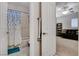 Bathroom featuring a shower-tub combo and easy access to the bedroom, blending convenience with practicality at 9475 Windham Heights Ct, Las Vegas, NV 89139
