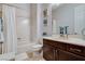 Bathroom featuring a shower-tub combo with a white shower curtain and a dark vanity at 9475 Windham Heights Ct, Las Vegas, NV 89139