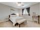 Cozy bedroom with a comfortable bed, decorative pillows, and a classic writing desk at 9475 Windham Heights Ct, Las Vegas, NV 89139