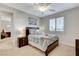 Inviting bedroom with a decorative bed, matching nightstand, and a peaceful ambiance at 9475 Windham Heights Ct, Las Vegas, NV 89139