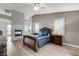 Inviting bedroom with wood floors, a fireplace, and plantation shutters offering natural light at 9475 Windham Heights Ct, Las Vegas, NV 89139