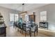 Dining room with a large table, modern lighting, and access to the outdoor patio at 9475 Windham Heights Ct, Las Vegas, NV 89139