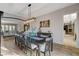 Dining area featuring modern lighting, wood floors, and an open concept layout at 9475 Windham Heights Ct, Las Vegas, NV 89139