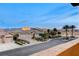 Exterior view showcasing the meticulously landscaped front yard and neighboring houses at 9475 Windham Heights Ct, Las Vegas, NV 89139