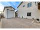 Spacious driveway leading to a detached garage of a bright stucco two-story home at 9475 Windham Heights Ct, Las Vegas, NV 89139