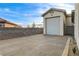 Detached garage featuring a large door, offering ample space for parking or a workshop at 9475 Windham Heights Ct, Las Vegas, NV 89139