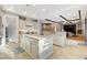 Open concept kitchen with dual islands, white cabinetry, and modern appliances at 9475 Windham Heights Ct, Las Vegas, NV 89139