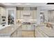 Well-equipped kitchen features granite counters, tile backsplash, stainless appliances, and ample cabinetry at 9475 Windham Heights Ct, Las Vegas, NV 89139