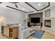 Comfortable living room with fireplace, TV, stylish cabinet and modern decor at 9475 Windham Heights Ct, Las Vegas, NV 89139