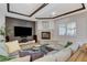 Cozy living room with a gray sectional sofa, fireplace, and contemporary decor at 9475 Windham Heights Ct, Las Vegas, NV 89139