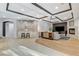 Open concept living room with bar, fireplace, and coffered ceilings at 9475 Windham Heights Ct, Las Vegas, NV 89139