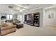 Upstairs loft area featuring custom built-ins, a fireplace, recessed lighting, and plush carpeting at 9475 Windham Heights Ct, Las Vegas, NV 89139