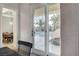 View from dining area to pool patio featuring palm trees and comfortable outdoor furniture at 9475 Windham Heights Ct, Las Vegas, NV 89139