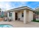 Pool house featuring a quaint sitting area, stylish patio, and shaded retreat at 9475 Windham Heights Ct, Las Vegas, NV 89139