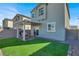 The backyard offers a covered patio, artificial turf, and block wall at 4735 Agave Cactus St, North Las Vegas, NV 89031