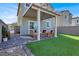 Backyard featuring a pergola, artificial turf, and patio at 4735 Agave Cactus St, North Las Vegas, NV 89031