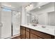 Bright bathroom featuring a glass shower, double sink vanity, and modern fixtures at 4735 Agave Cactus St, North Las Vegas, NV 89031