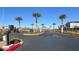 Gated community entrance featuring desert landscaping and palm trees leading into an upscale neighborhood at 4735 Agave Cactus St, North Las Vegas, NV 89031