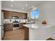 Well-appointed kitchen with stainless steel appliances, white subway tile backsplash, and an island at 4735 Agave Cactus St, North Las Vegas, NV 89031